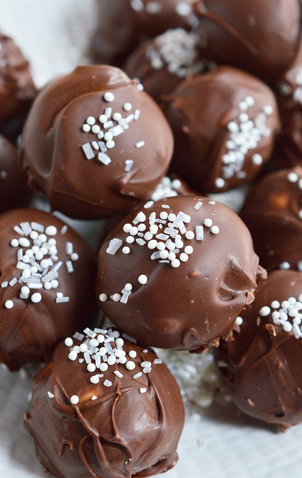 It's time for holiday treat platters and homemade gifts. These No-Bake Peppermint Pattie Chocolate Truffles will be the star of any Christmas dessert tray! Cool peppermint filling is shaped into balls and coated with chocolate then topped with sprinkles.