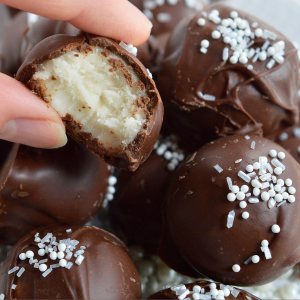 It's time for holiday treat platters and homemade gifts. These Peppermint Pattie Chocolate Truffles will be the star of any Christmas dessert tray! Cool peppermint filling is shaped into balls and coated with chocolate then topped with sprinkles.