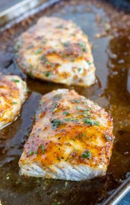 sliced pork chop on rimmed baking sheet