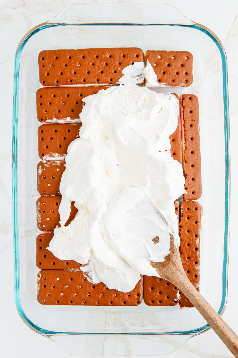 whipped topping smeared on ice cream sandwiches