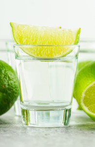 clear shot in glass topped with lime wedge