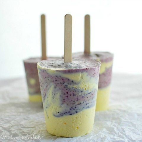 three frozen yellow and purple popsicles