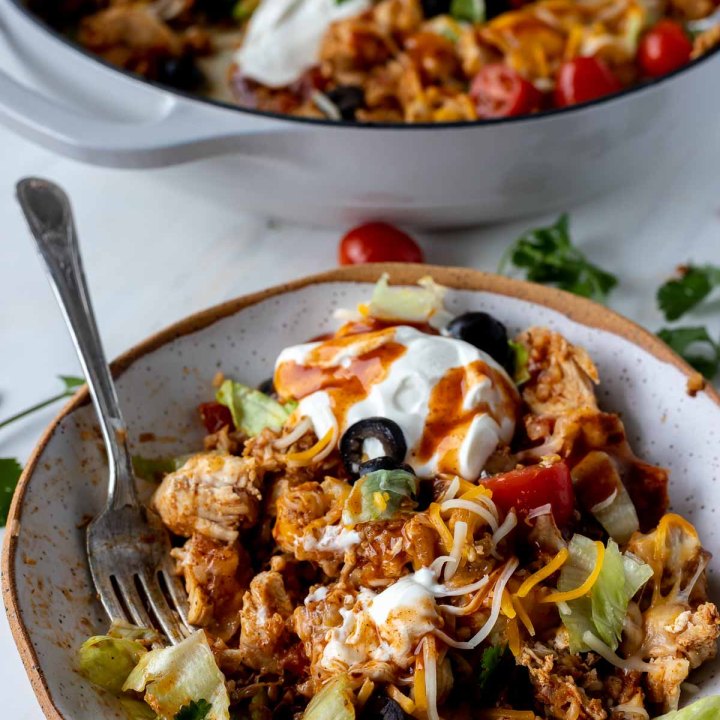 casserole served in white bowl with fork