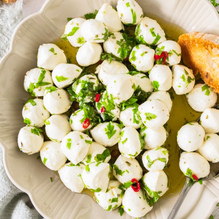 mozzarella balls and herbs in bowl