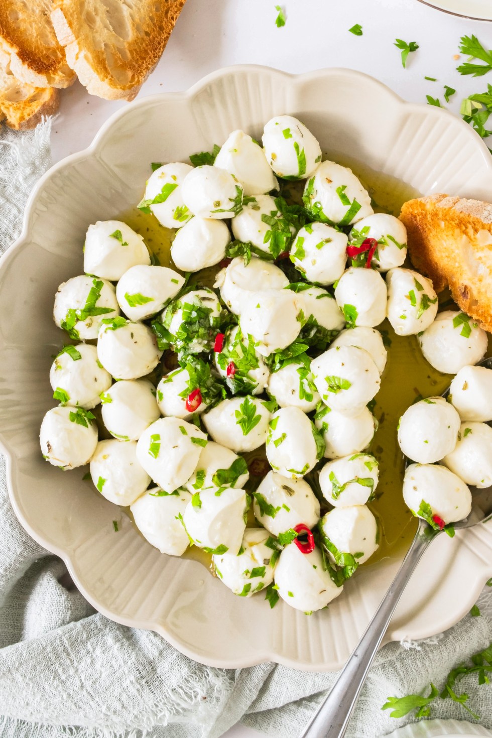 mozzarella balls and herbs in bowl