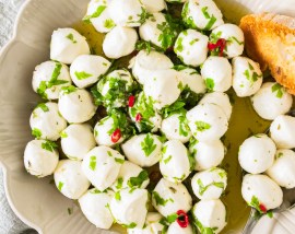 mozzarella balls and herbs in bowl