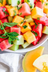 different color melon cubes with mint