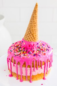 bright pink cake topped with ice cream cone