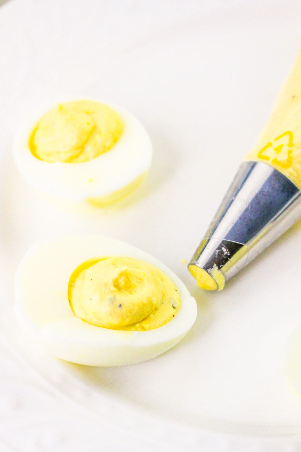 yolk filling piped into egg white