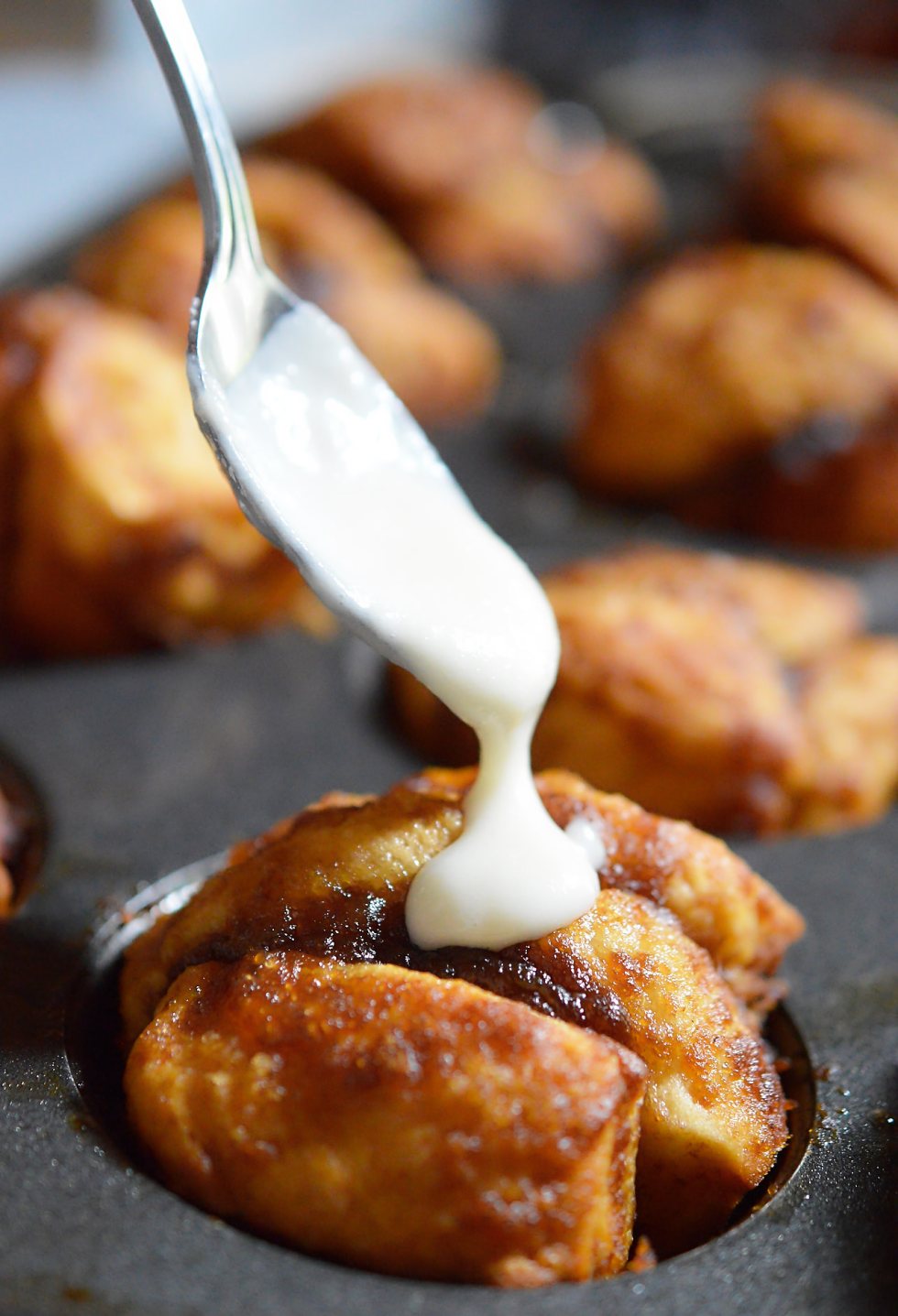 Need an easy breakfast recipe that will feed your hungry crowd? These Monkey Bread Muffins are made with just 4 ingredients and take no time at all! Like sticky buns with a cream cheese glaze without all the hassle.