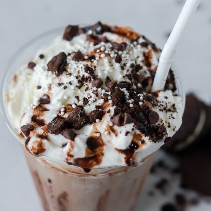 frappuccino topped with whipped cream cookies and chocolate sauce