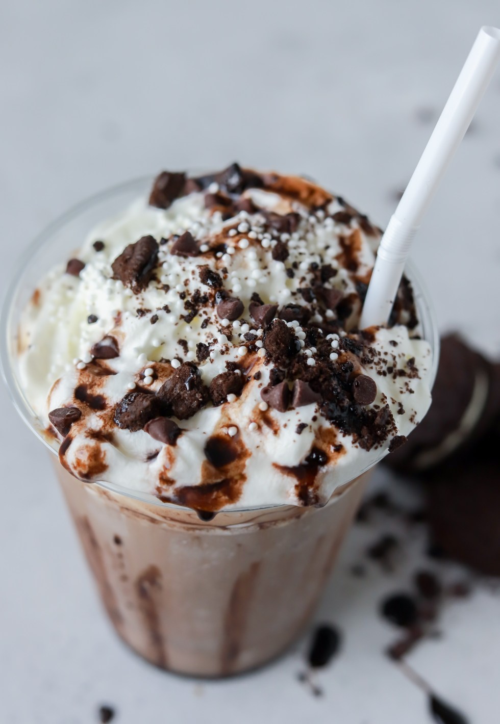 frappuccino topped with whipped cream cookies and chocolate sauce