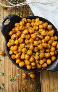 If you're looking for a healthy snack to satisfy that salty, crunchy craving, these Crispy Roasted Chickpeas are it! Learn how to toast chickpeas in the oven making them a nutritious high protein snack recipe.