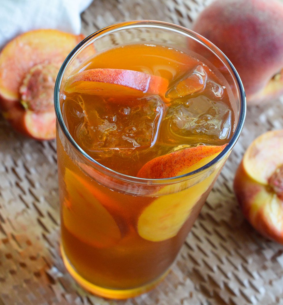 Peach Iced Tea Recipe - This sun tea is infused with fresh ripe peaches and honey. A refreshing and natural summertime beverage!