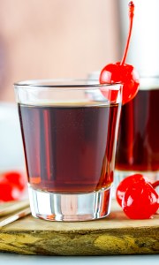 brown liquid in clear shot glass