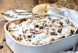 Go ahead and indulge your sweet craving with this Rum Raisin Croissant Bread Pudding Bake Recipe. Perfect for a dessert to feed a crowd or as an easy breakfast casserole.