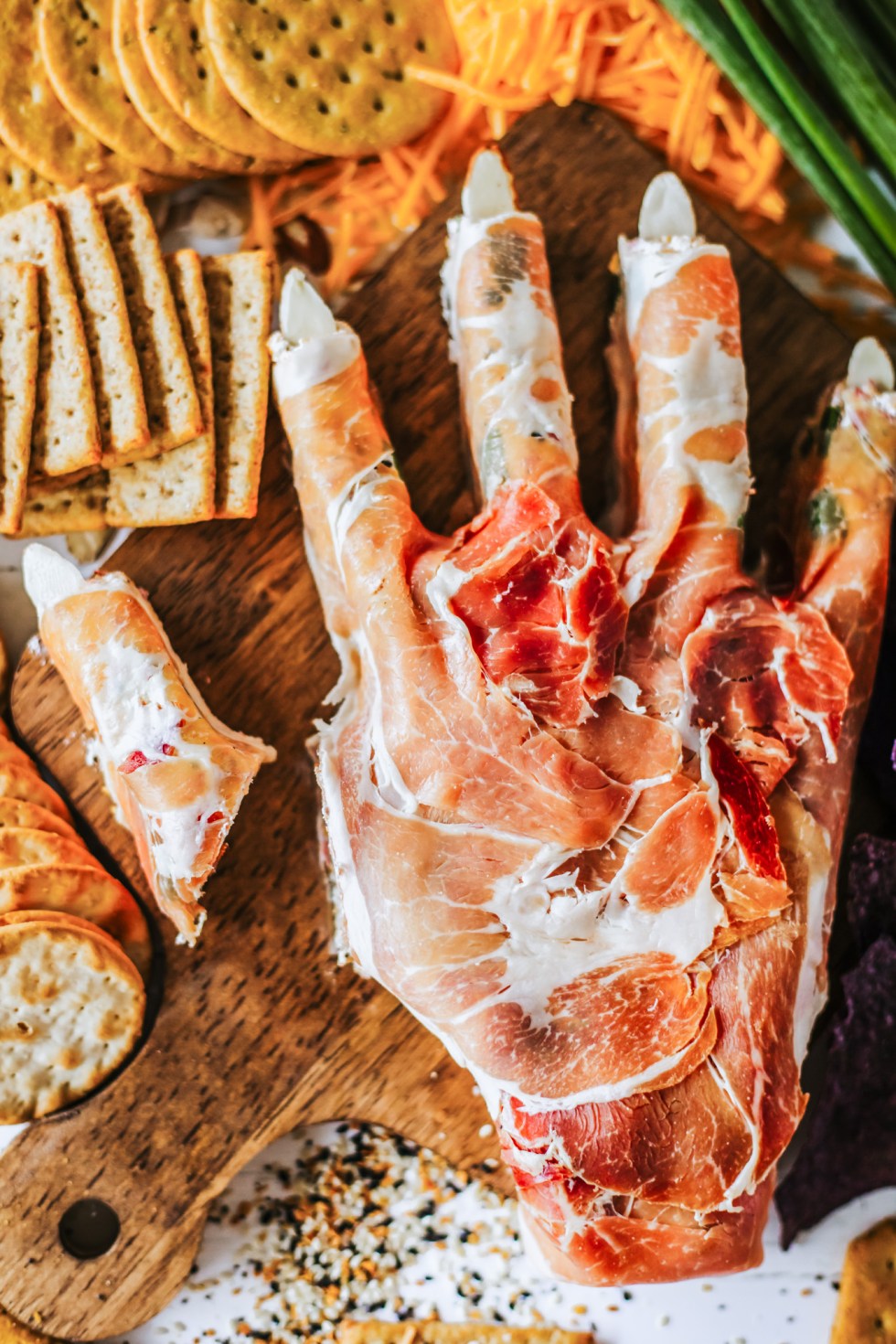 finger cut from hand shaped cheese dip