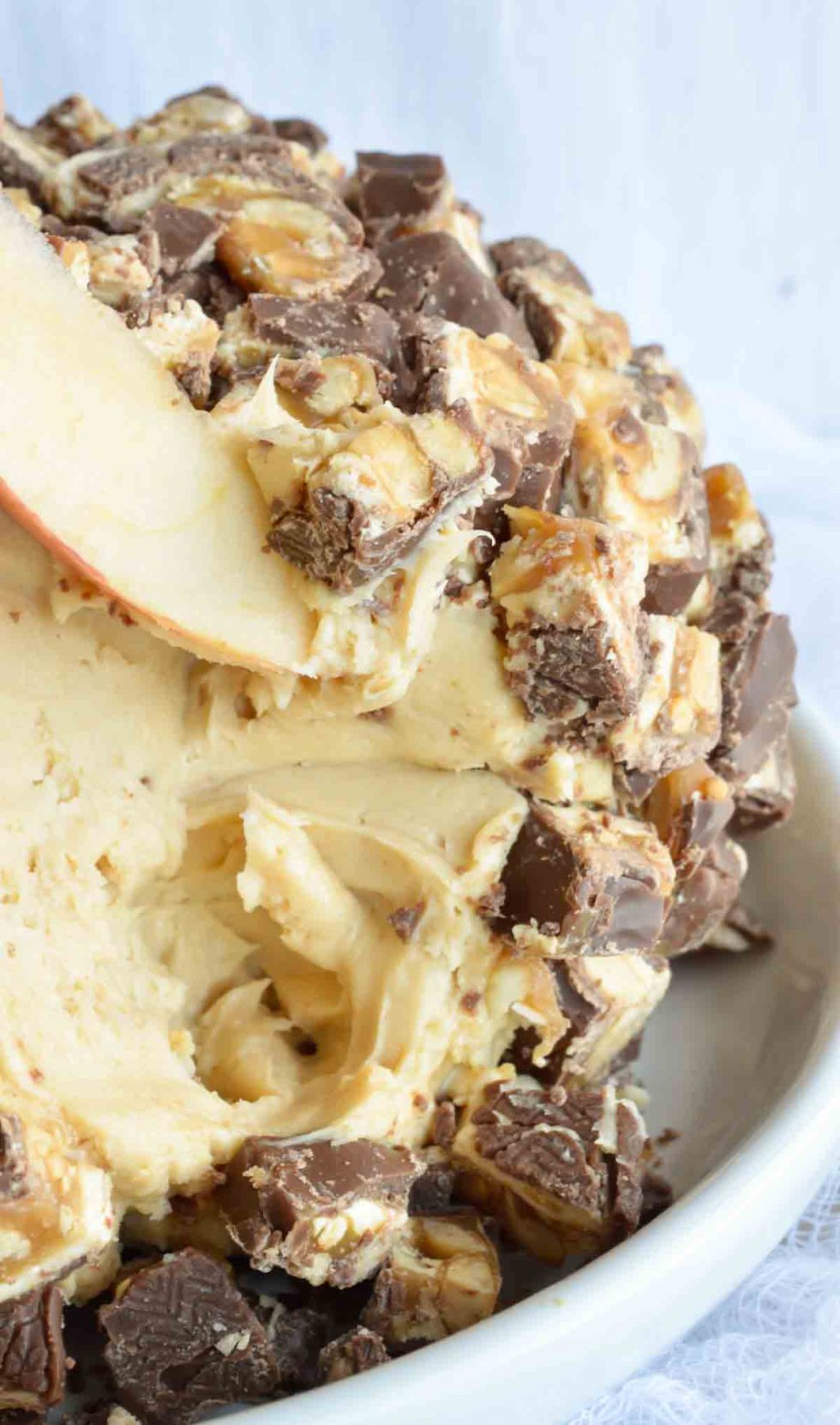 This Sweet Snickers Cheese Ball Recipe is perfect for your game day party! This dessert dip will be a crowd favorite!