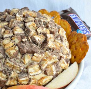 This Sweet Snickers Cheese Ball Recipe is perfect for your game day party! This dessert dip will be a crowd favorite!