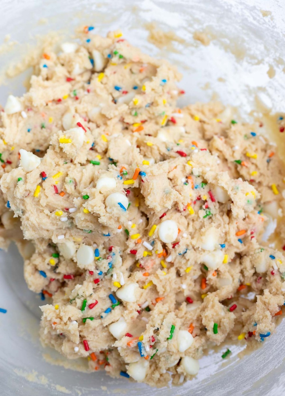 mixed cookie dough in clear glass bowl