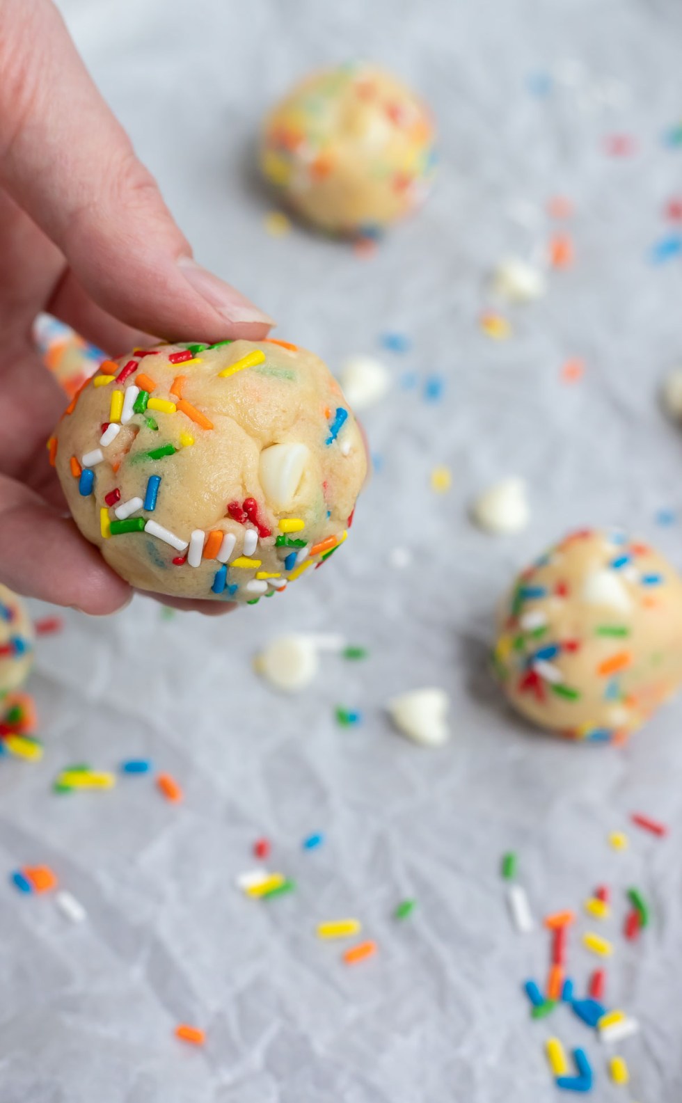 hand holding cookie dough ball