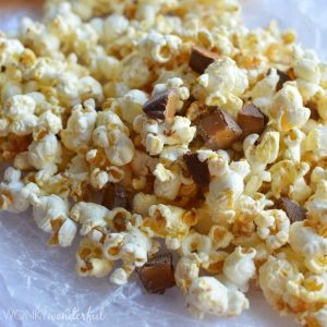 closeup of popped popcorn and candy chunks