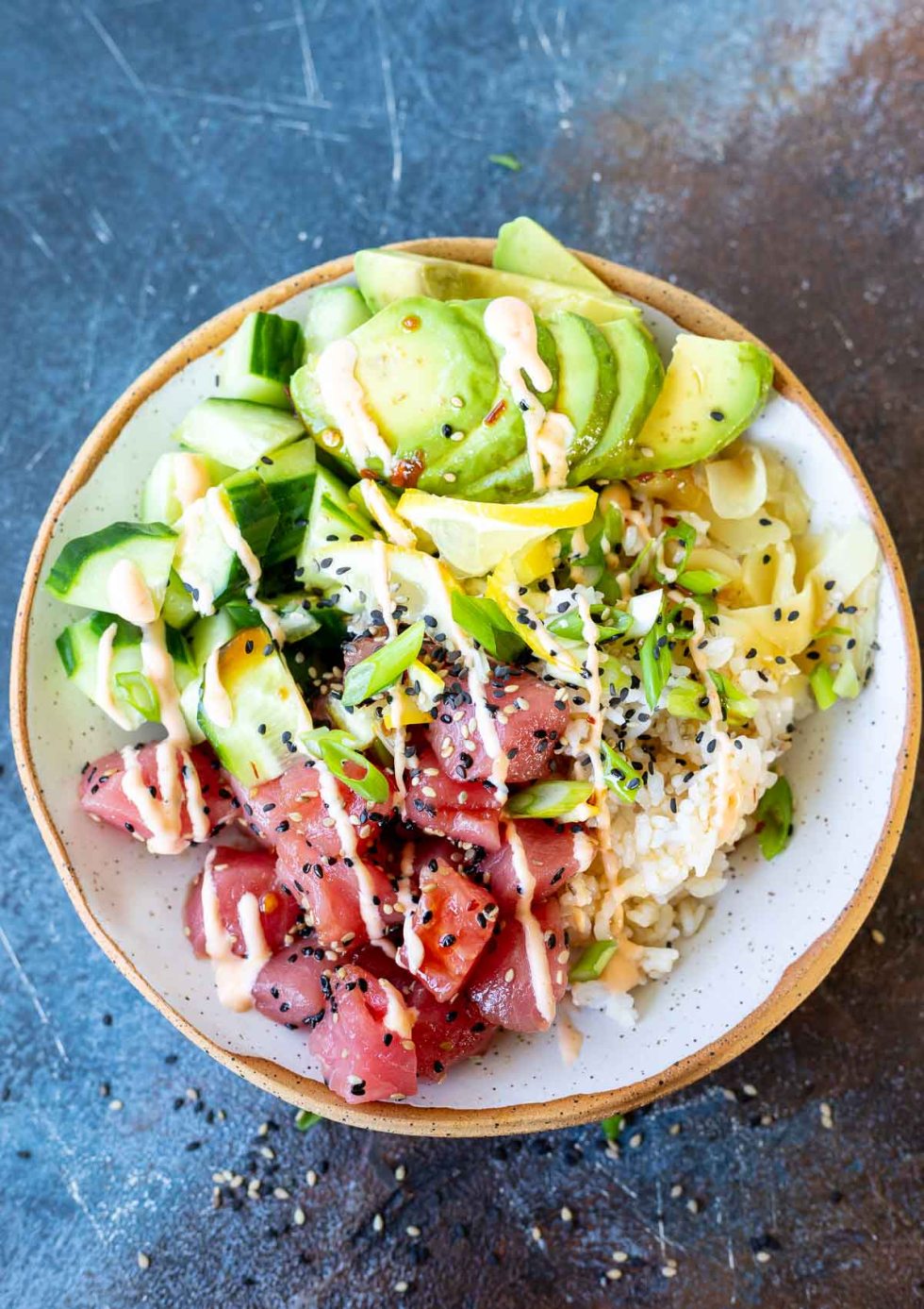 prepared tuna poke served in white speckled bowl