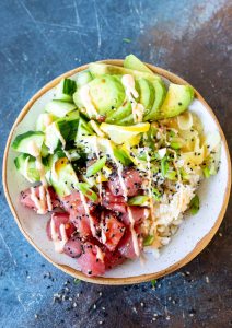 prepared tuna poke served in white speckled bowl