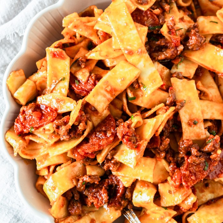 pasta and sauce in white bowl