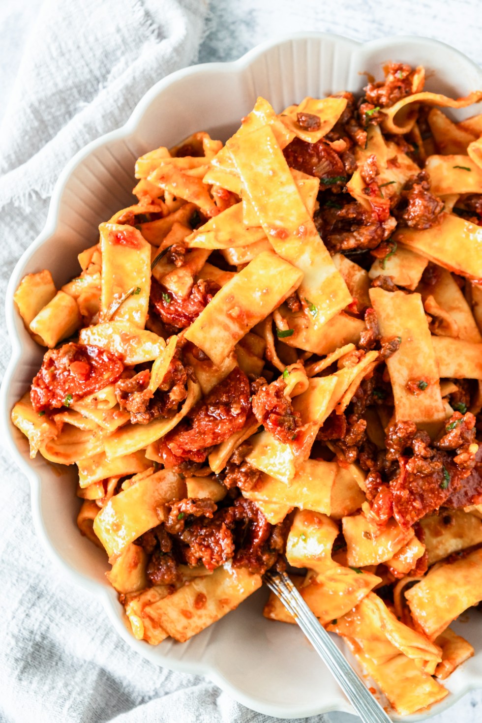 pasta and sauce in white bowl