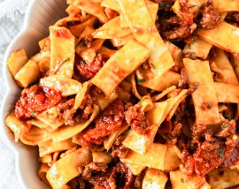 pasta and sauce in white bowl