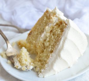 Bake a cake just like Grandma used to with this Vintage Buttermilk Vanilla Cake Recipe From Scratch. A delicate layer cake topped with homemade vanilla buttercream frosting!