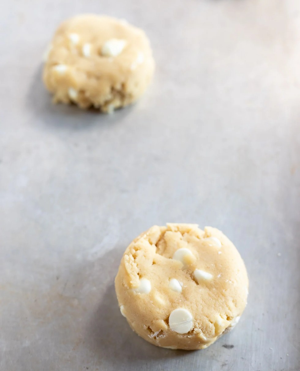 cookie dough scoops on baking sheet